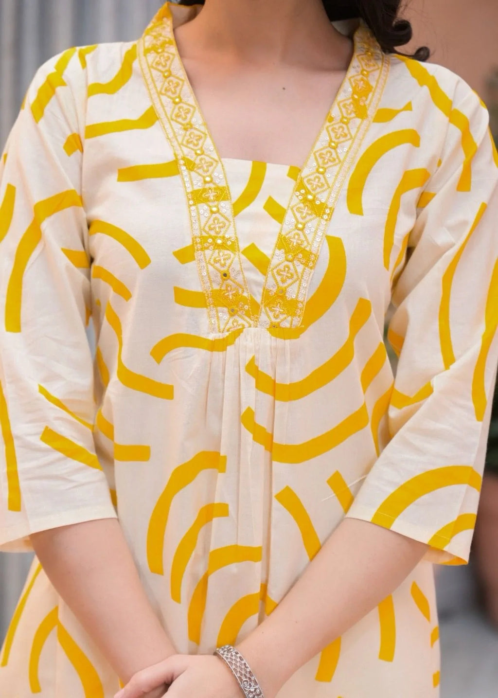 yellow kurta ethnic print fabric detail close up
